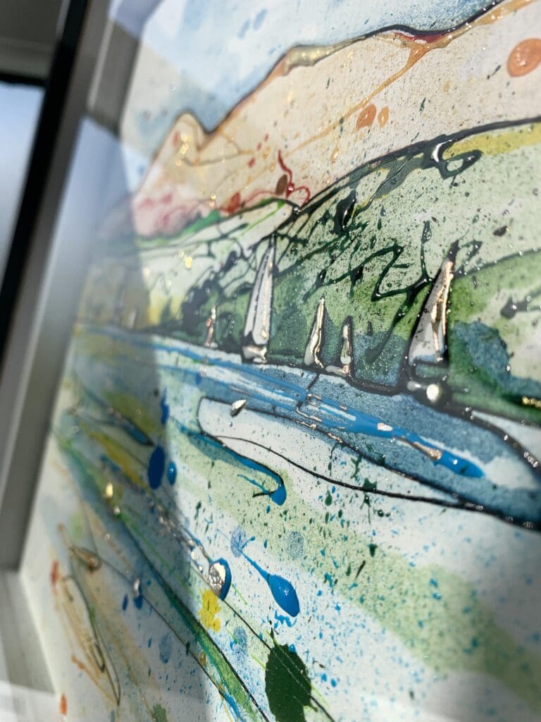 A close up of a painting by Kathryn Callaghan named Set Sail, Strangford Lough. It features small white sailboats on Strangford Lough, overlooked by The Mourne Mountains.