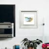 Bangor Pier by Kathryn Callaghan, shown in a deluxe white frame in situ.