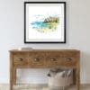 A 45x45cm print of Benone Strand by Kathryn Callaghan shown in a deluxe black frame in situ.