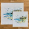Two prints of Benone Strand by Kathryn Callaghan to show the size difference between the 45cm print and the 30cm print.