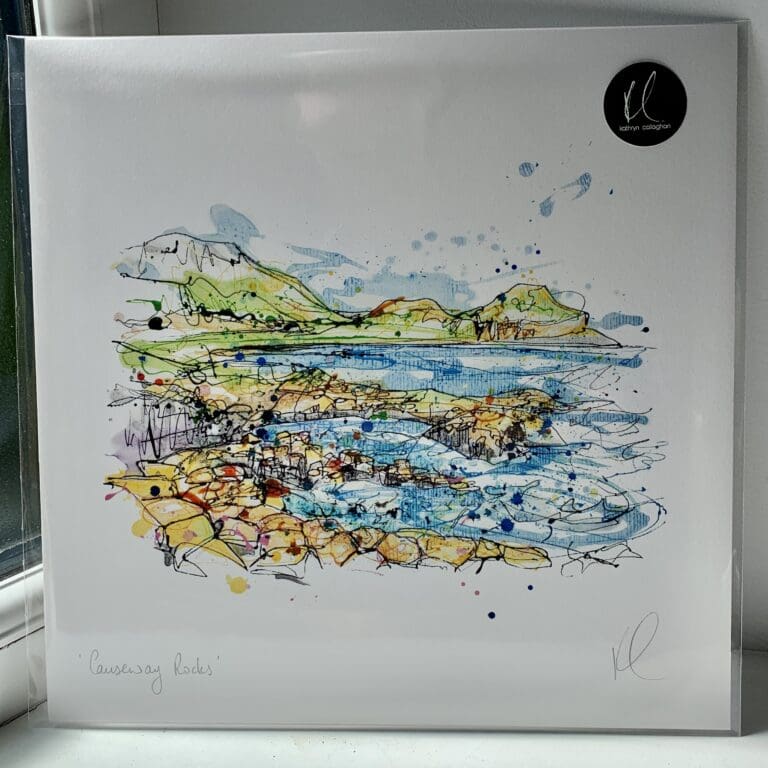 A 30cm print of Causeway Rocks by Kathryn Callaghan, shown packaged with a backing board in a clear cello bag with a gold KC sticker.