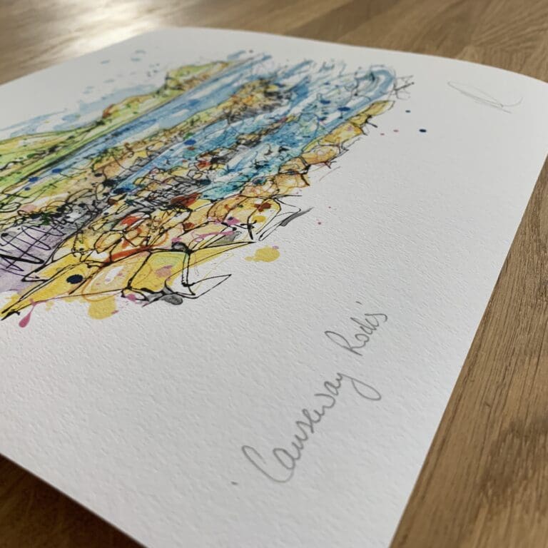 Photograph of Causeway Rocks by Kathryn Callaghan, which shows the print's title handwritten in the bottom left corner and the artist's signature in the bottom right, with space between to add a custom personalisation.