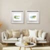 30x30cm prints of White Rocks from Magehracross and Benone Strand by Kathryn Callaghan, both shown in deluxe white frames in situ.