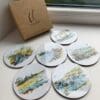 Six coasters featuring prints of Northern Ireland landscapes by Kathryn Callaghan.